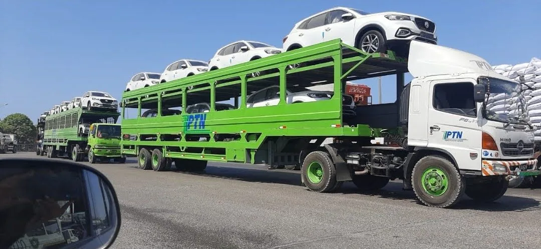 PTN lime-green car carriers transporting white vehicles