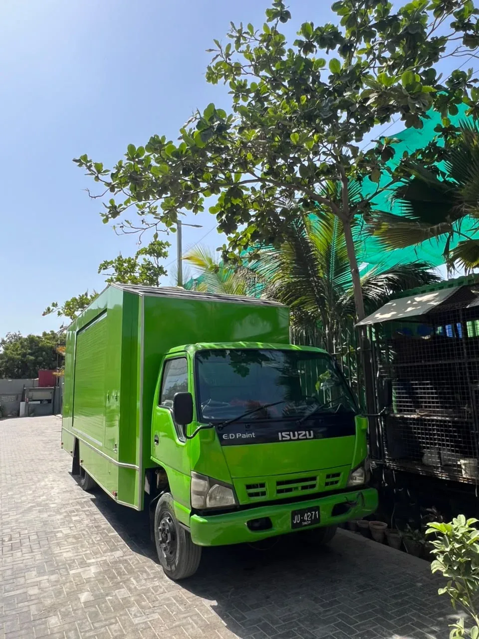 Front view of PTN’s actual lime-green enclosed carrier