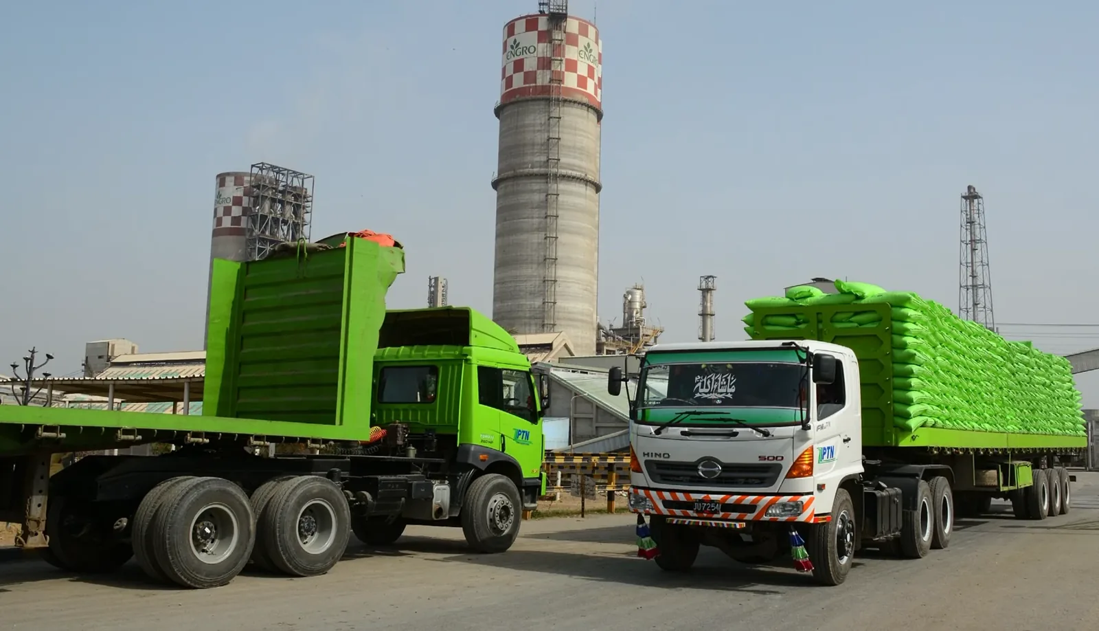 Fertilizer trucks at an industrial location