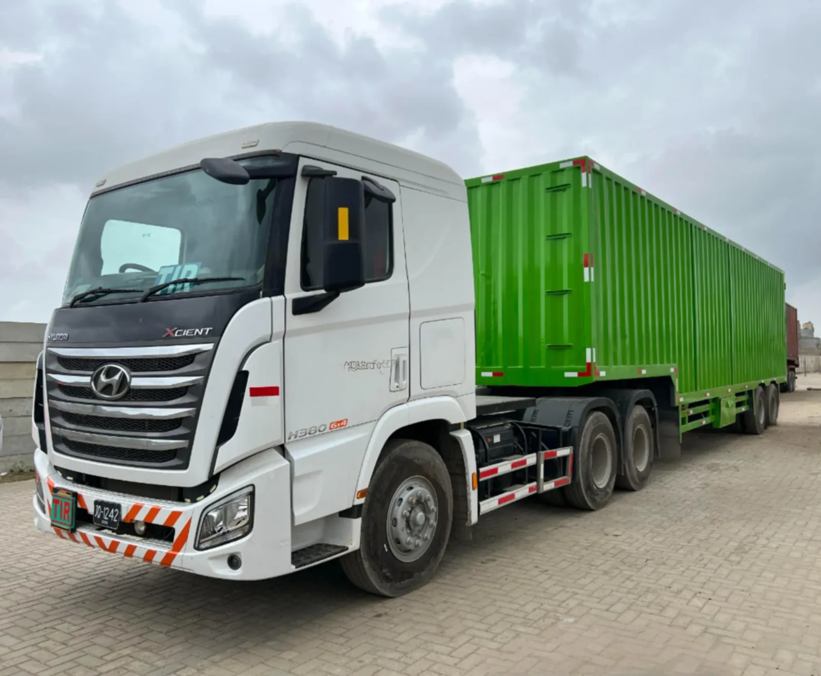 Hyundai tractor with lime-green PTN container